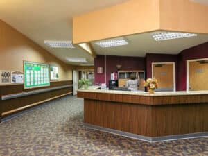 Nurse filing papers at the nurses station.